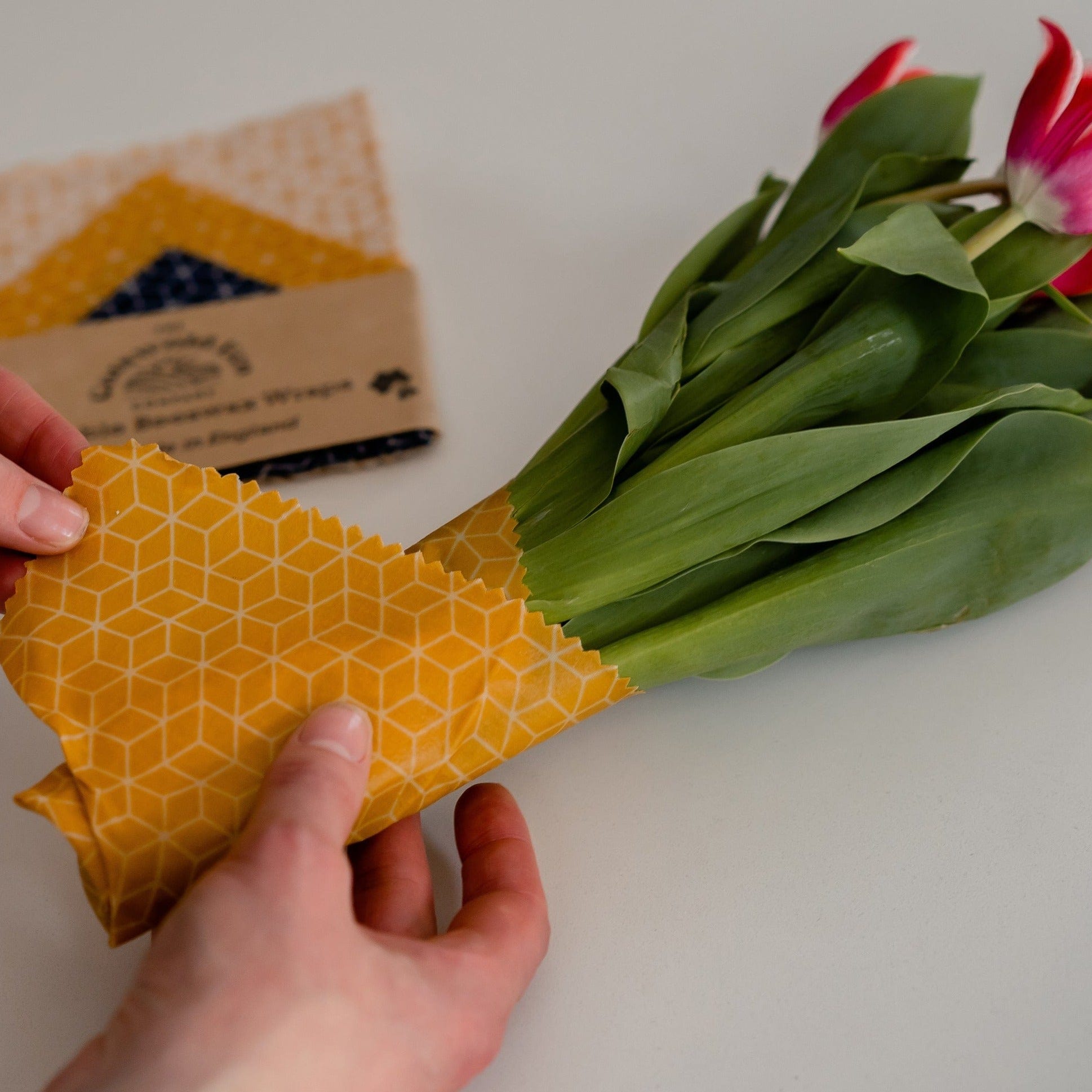Handmade Beeswax Wraps - wrapping a bunch of pink tulip flowers