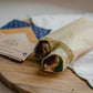 The Cotswold Eco Company Handmade Beeswax Wrap - used to wrap filled wraps for lunch